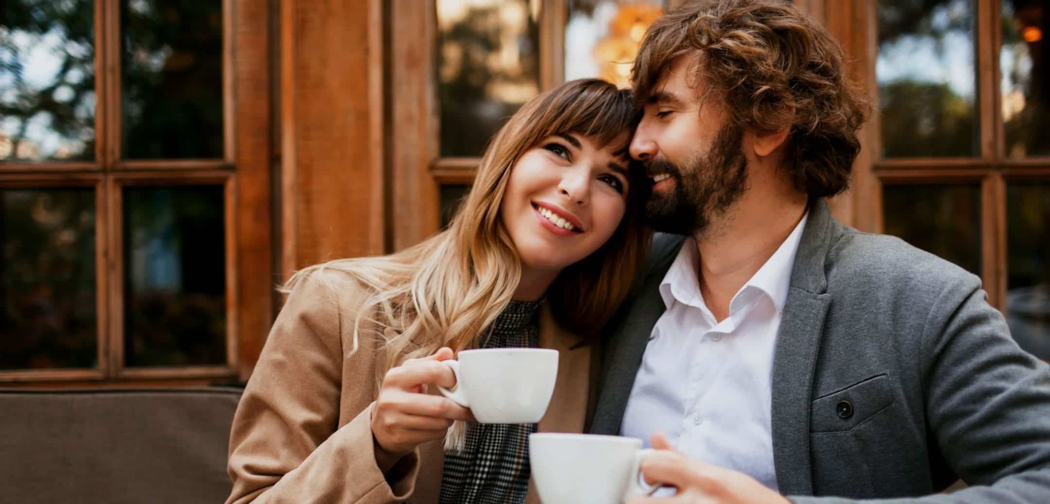 couple love sitting cafe drinking coffee having conversation enjoying time spend with each other selective focus cup